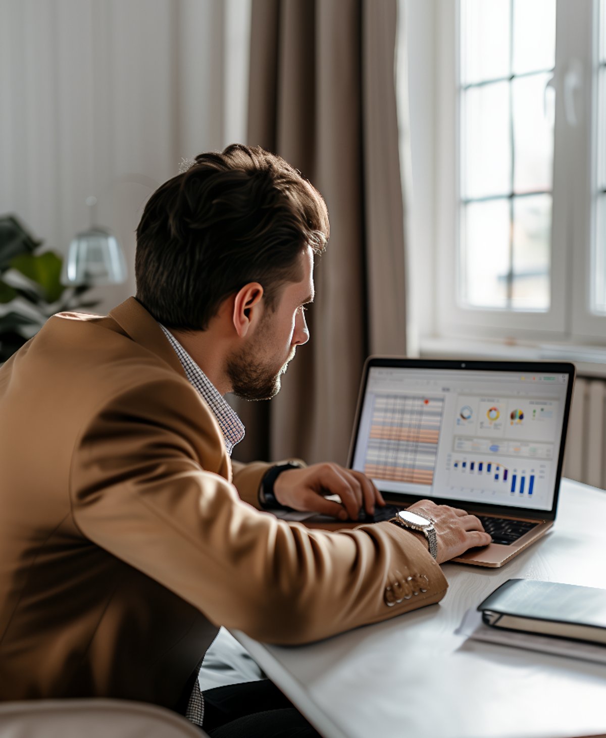 Investor using laptop, highlighting Why Wait Italy's expertise in facilitating the Investor Visa for relocation to Italy.